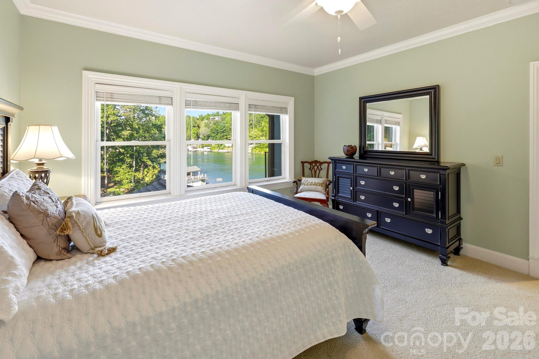 151 Garner Road Lake Lure, NC 28746 - Photo 24 of 48 a bedroom with a bed and a large window