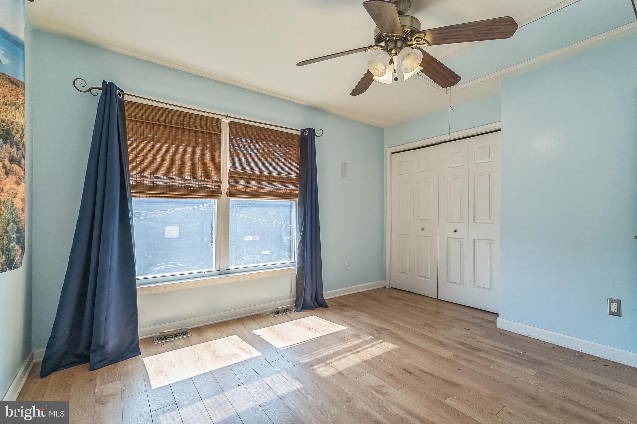 3566 Edgemont Street Philadelphia, PA 19134 - Photo 17 of 25 wooden floor in an empty room with a window
