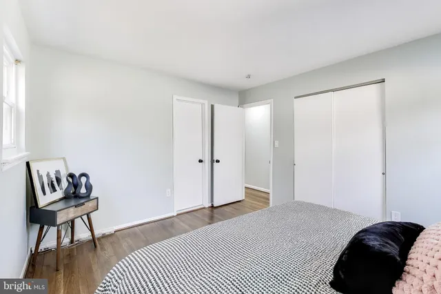 a bedroom with a bed and a chair