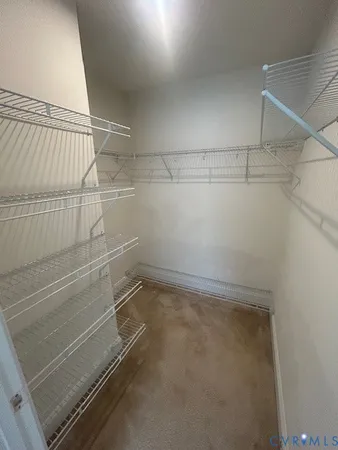 a view of a room with racks on the wall