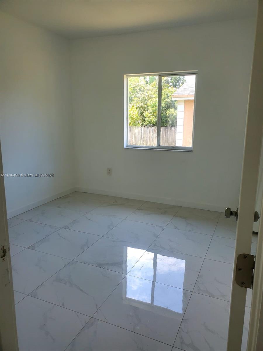 Brownsville Miami, FL 33142 - Photo 14 of 15 an empty room with windows