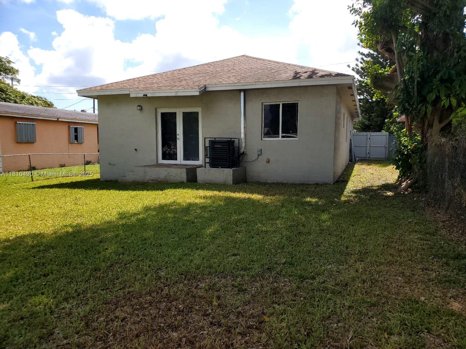 Brownsville Miami, FL 33142 - Photo 3 of 15 a view of a house with a yard