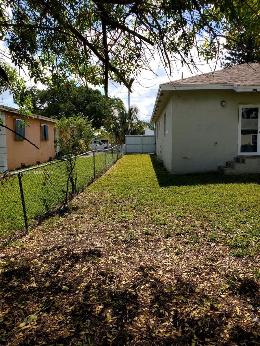 Brownsville Miami, FL 33142 - Photo 4 of 15 a view of a backyard
