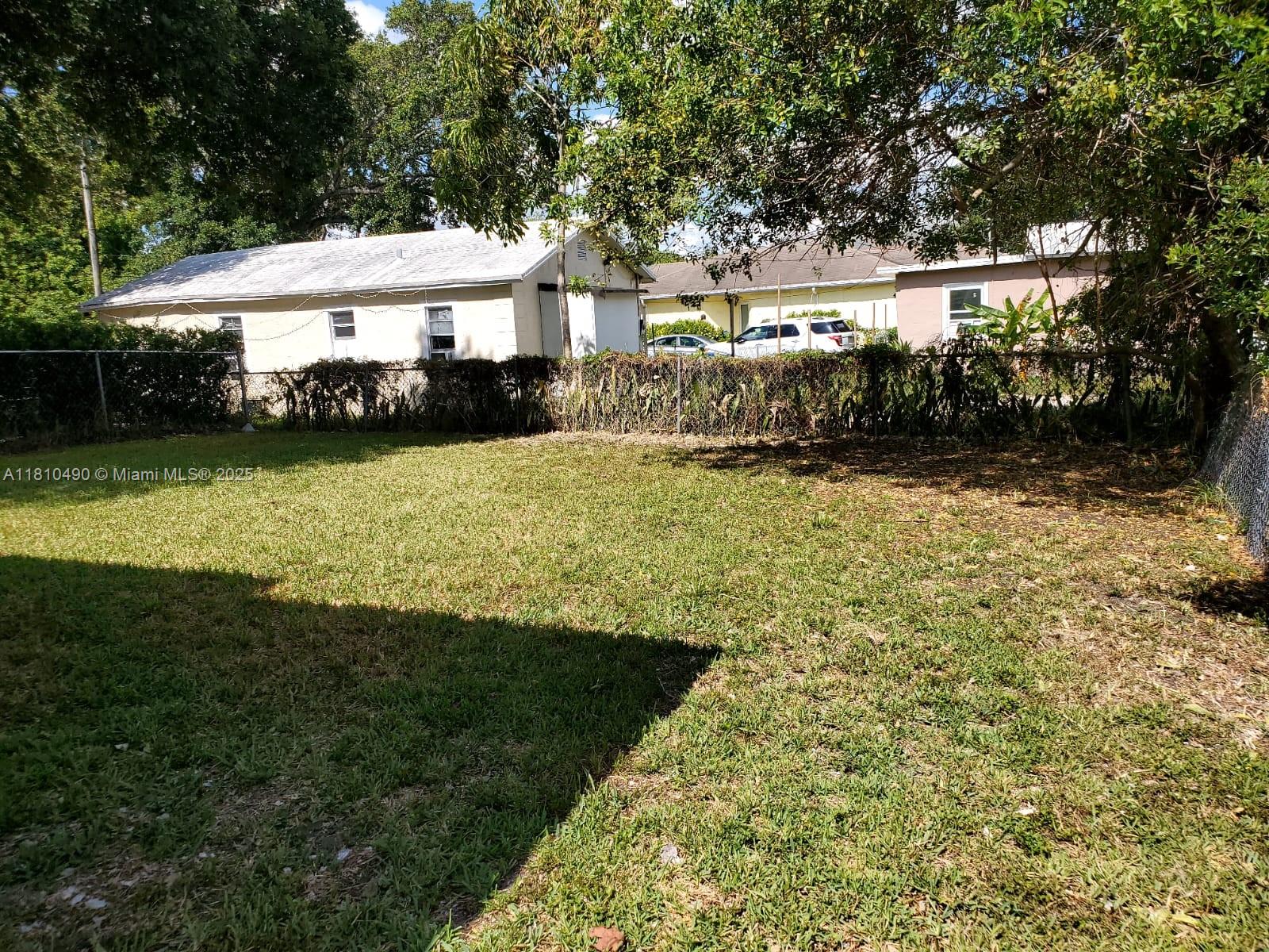 Brownsville Miami, FL 33142 - Photo 5 of 15 a front view of a house with garden