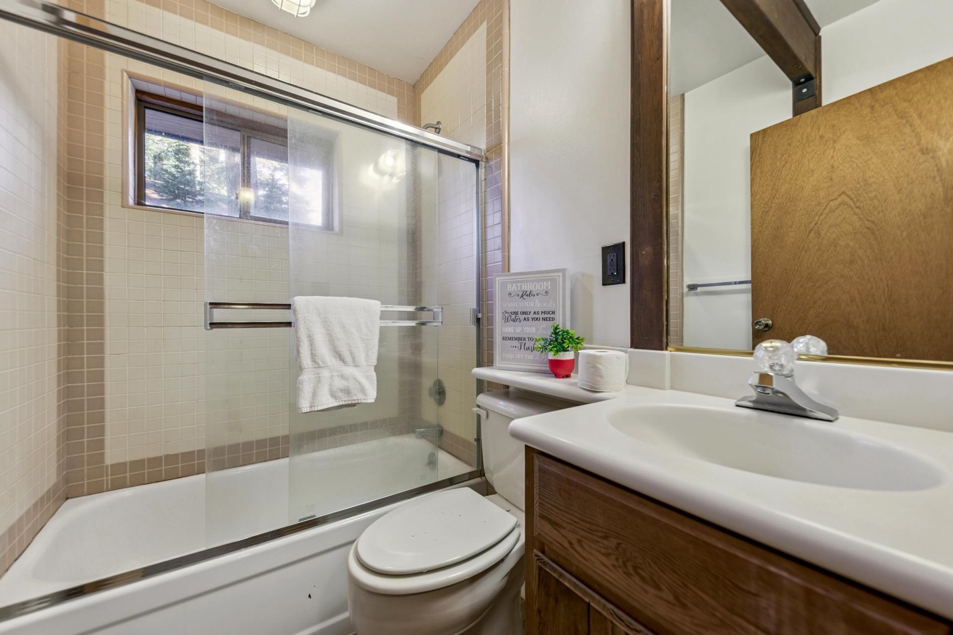 14527 Christie Lane Truckee, CA 96161 - Photo 14 of 19 a bathroom with a sink toilet and shower
