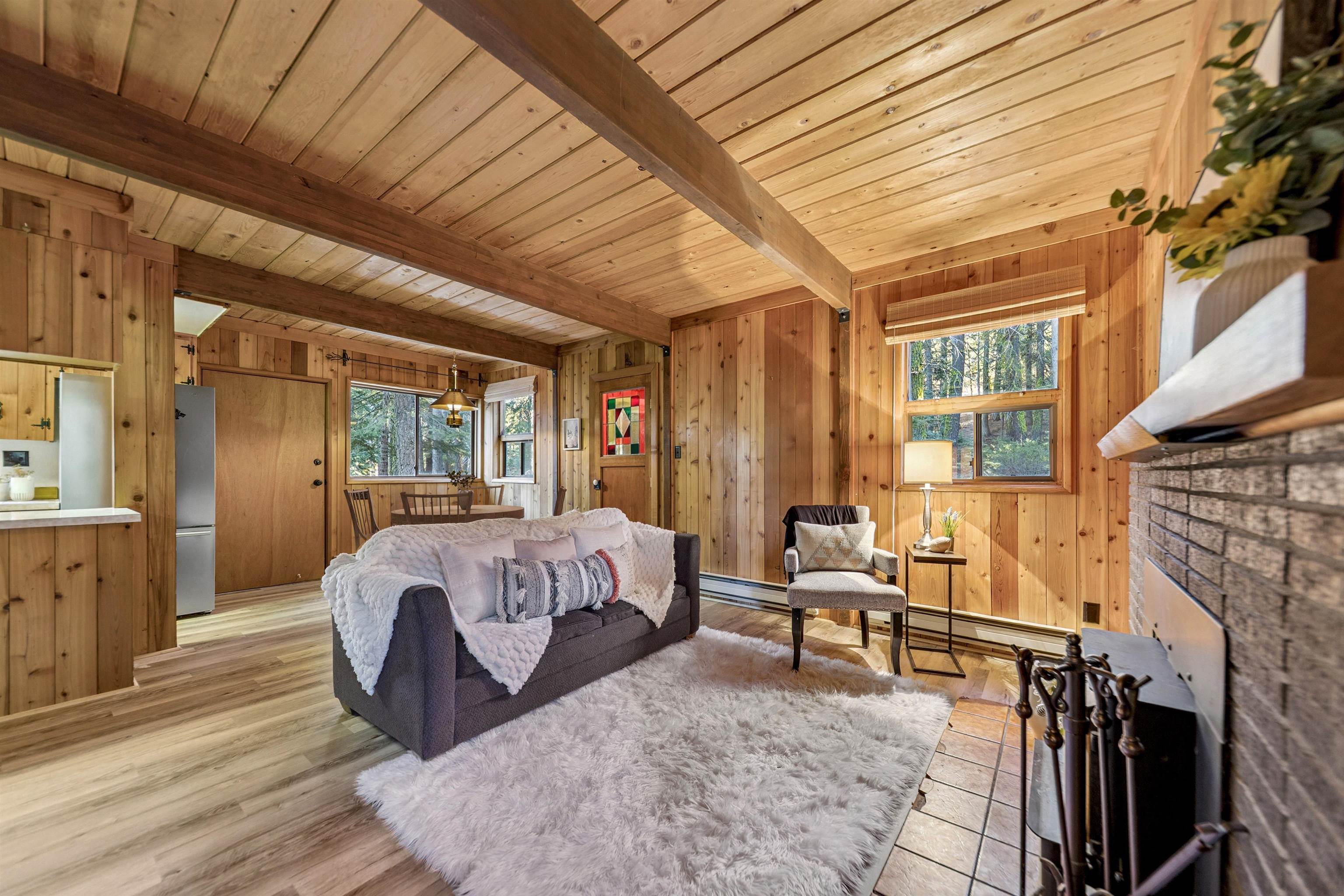 14527 Christie Lane Truckee, CA 96161 - Photo 6 of 19 a spacious bedroom with a bed and wooden floor