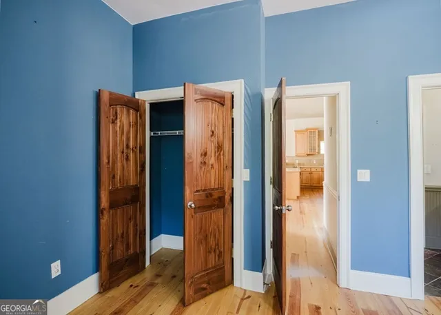 a bathroom with a glass door shower and a sink