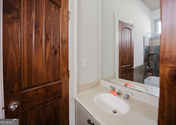 326 Fulton Road Tiger, GA 30576 - Photo 16 of 17 a bathroom with a sink vanity and a mirror
