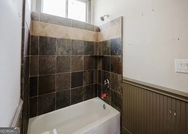 a bathroom with a bathtub