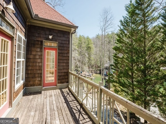 326 Fulton Road Tiger, GA 30576 - Photo 3 of 17 a view of a balcony with wooden floor and fence