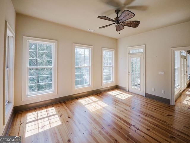 326 Fulton Road Tiger, GA 30576 - Photo 7 of 17 a view of an empty room with wooden floor and a window
