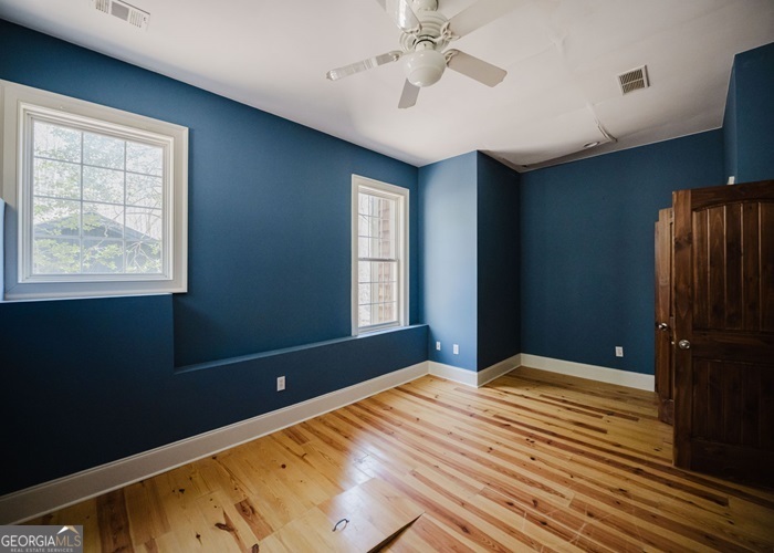 326 Fulton Road Tiger, GA 30576 - Photo 8 of 17 a bedroom with a bed and a window