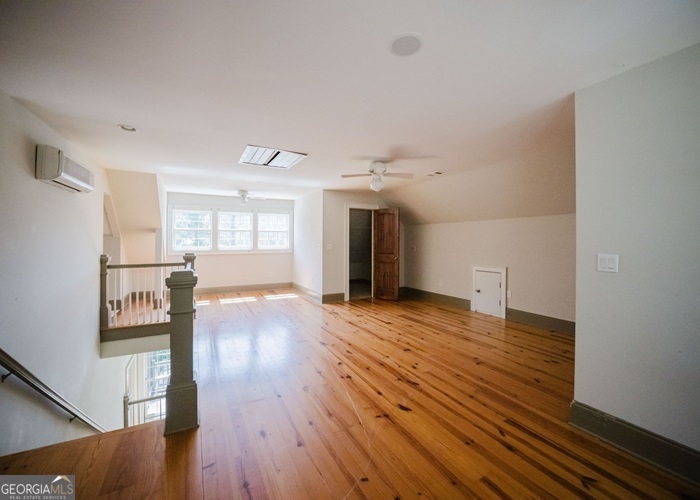 326 Fulton Road Tiger, GA 30576 - Photo 9 of 17 a view of empty room with wooden floor and fan