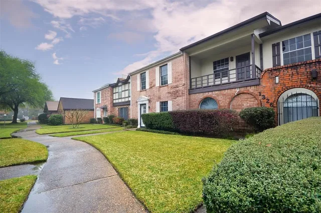 a huge green field with lots of trees