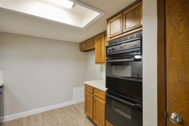a kitchen with a refrigerator and stove