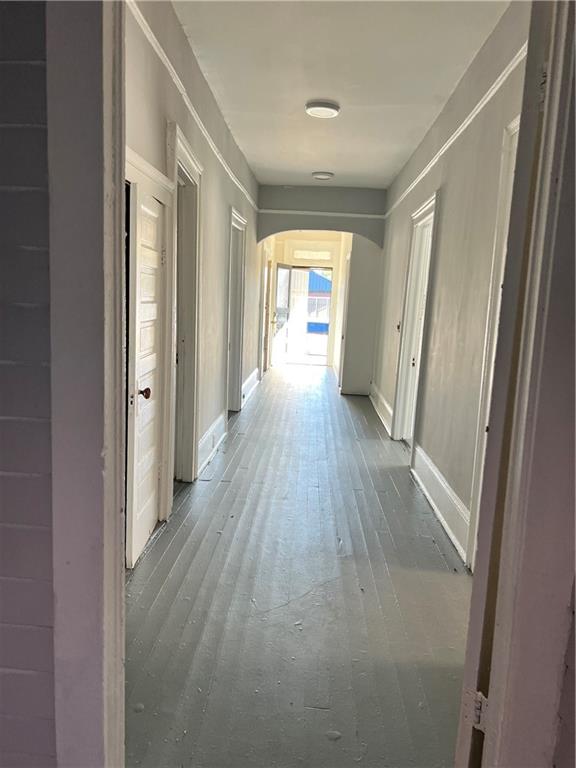 579 Charles Street Macon, GA 31206 - Photo 2 of 12 a view of a hallway with wooden floor and a window