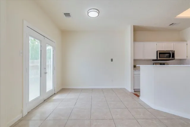 a view of a kitchen with a sink cabinets and a refrigerator