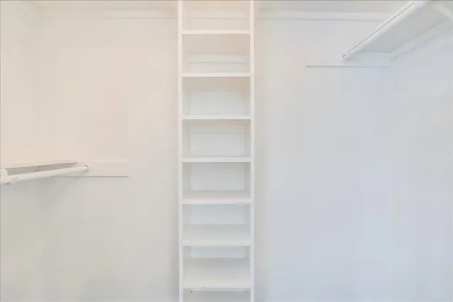 a view of an empty walk in closet