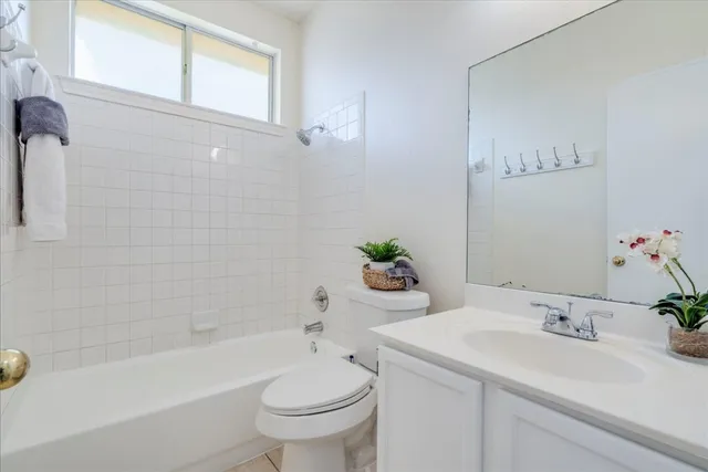 a bathroom with a sink a toilet and bathtub
