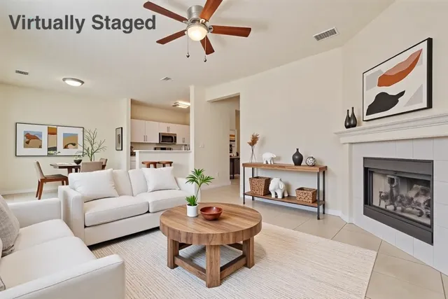 a living room with furniture and a fireplace