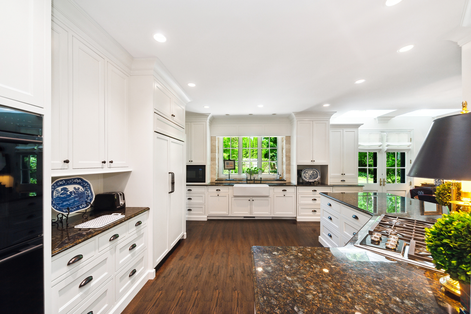 370 North Mayflower Road Lake Forest, IL 60045 - Photo 13 of 29 a large white kitchen with lots of appliances wooden cabinets a stove and a window