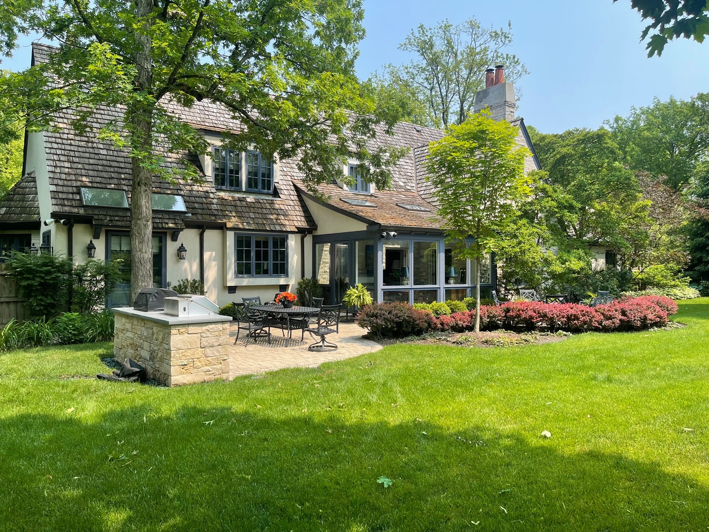 370 North Mayflower Road Lake Forest, IL 60045 - Photo 26 of 29 a front view of a house with garden and sitting area