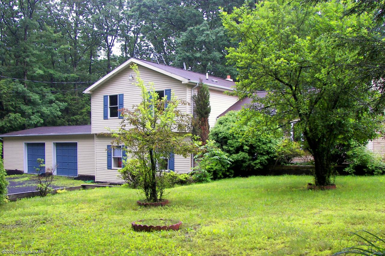 607 Kroucher Road Stroudsburg, PA 18360 - Photo 1 of 5 a view of a house with backyard and garden