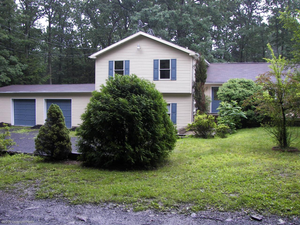 607 Kroucher Road Stroudsburg, PA 18360 - Photo 2 of 5 a house that has a lot of plants in it