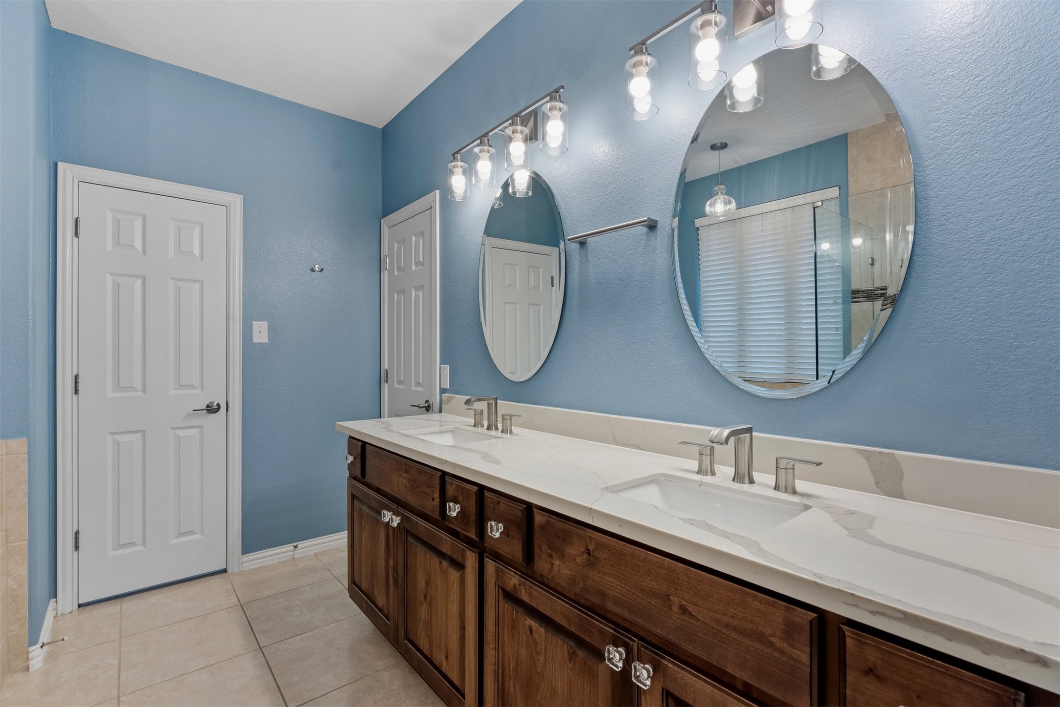 3935 Bowstring Bend Cedar Park, TX 78613 - Photo 24 of 39 Two individual sink areas offer plenty of personal room, making it easy for two people to get ready at once without any hassle
