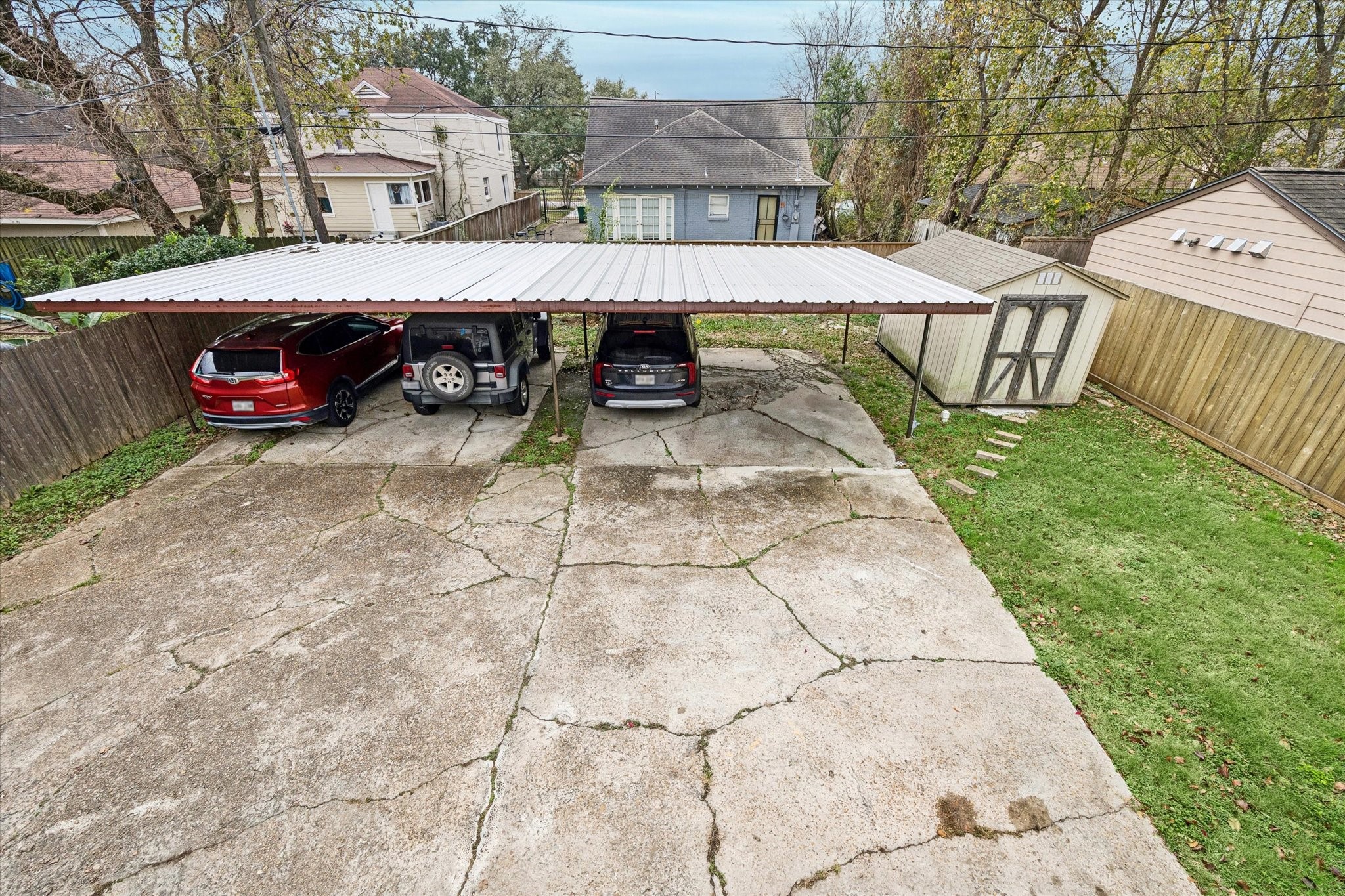 2614 Cleburne Street Houston, TX 77004 - Photo 20 of 22 Unrivaled urban utility. The expansive rear yard features a covered carport designed for up to four vehicles, a rare asset in this vibrant neighborhood.