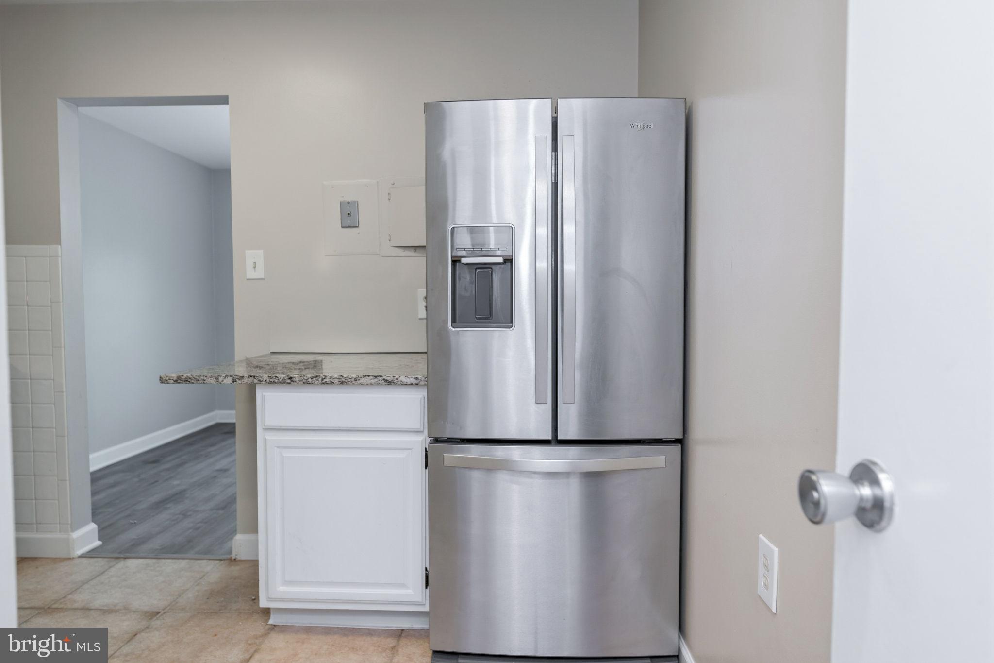 1443 Northgate Square, Unit 22B Reston, VA 20190 - Photo 10 of 42 a metallic refrigerator freezer and a stove sitting inside of a kitchen