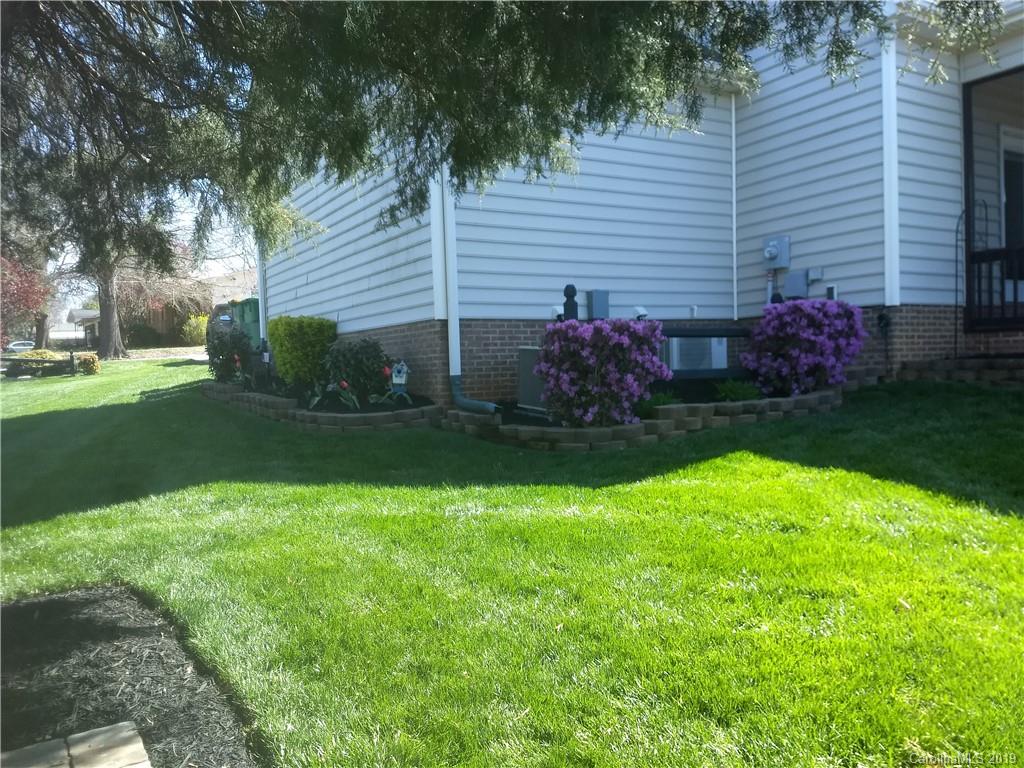 206 Broad Street Locust, NC 28097 - Photo 5 of 5 a view of a backyard with plants and large tree