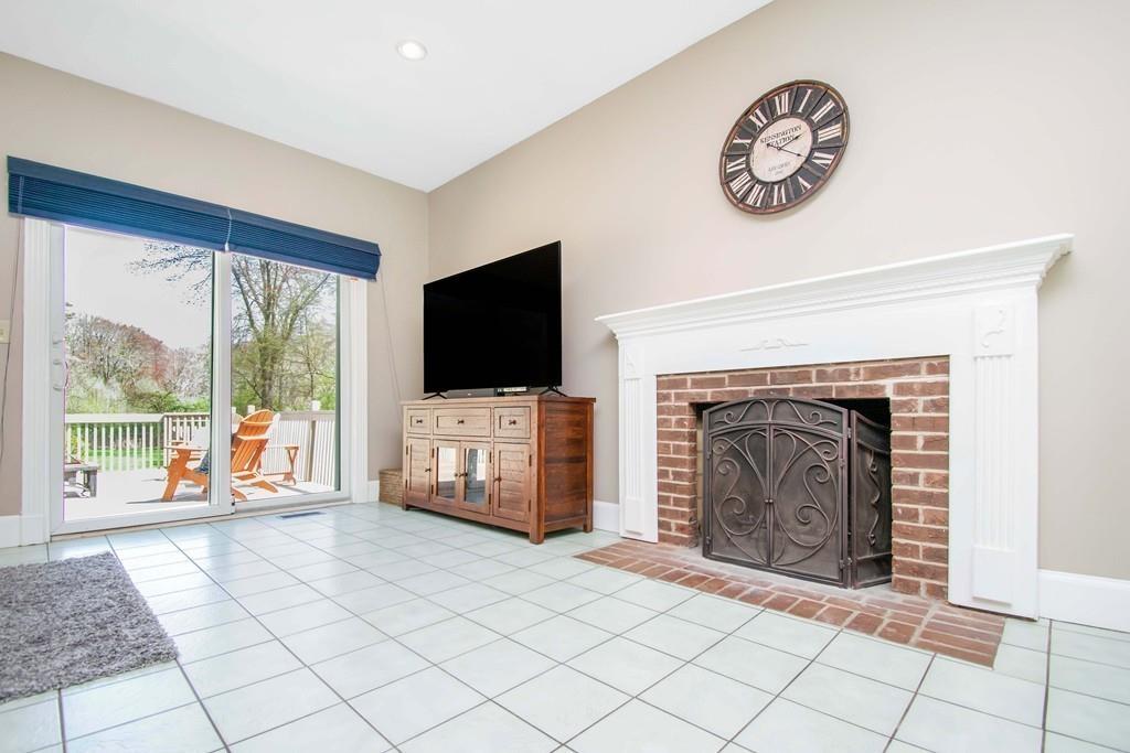 51 Steele Road Enfield, CT 06082 - Photo 11 of 42 a living room with furniture and a flat screen tv