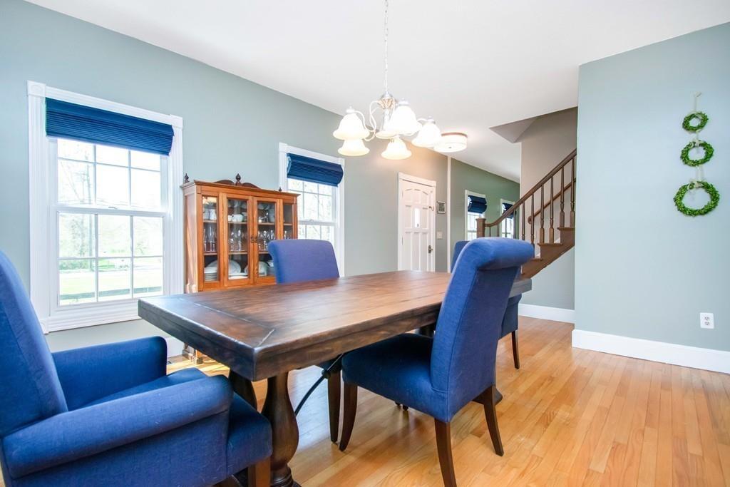 51 Steele Road Enfield, CT 06082 - Photo 14 of 42 a view of a dining room with furniture and wooden floor