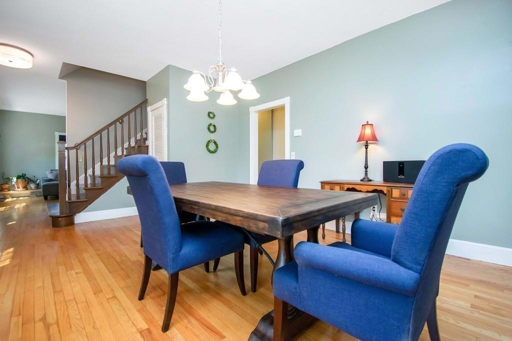 51 Steele Road Enfield, CT 06082 - Photo 15 of 42 a view of a dining room with furniture and wooden floor