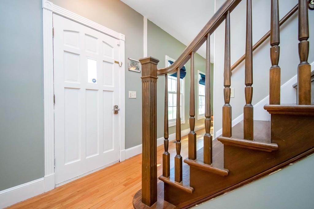 51 Steele Road Enfield, CT 06082 - Photo 16 of 42 a view of an entryway with wooden floor and door