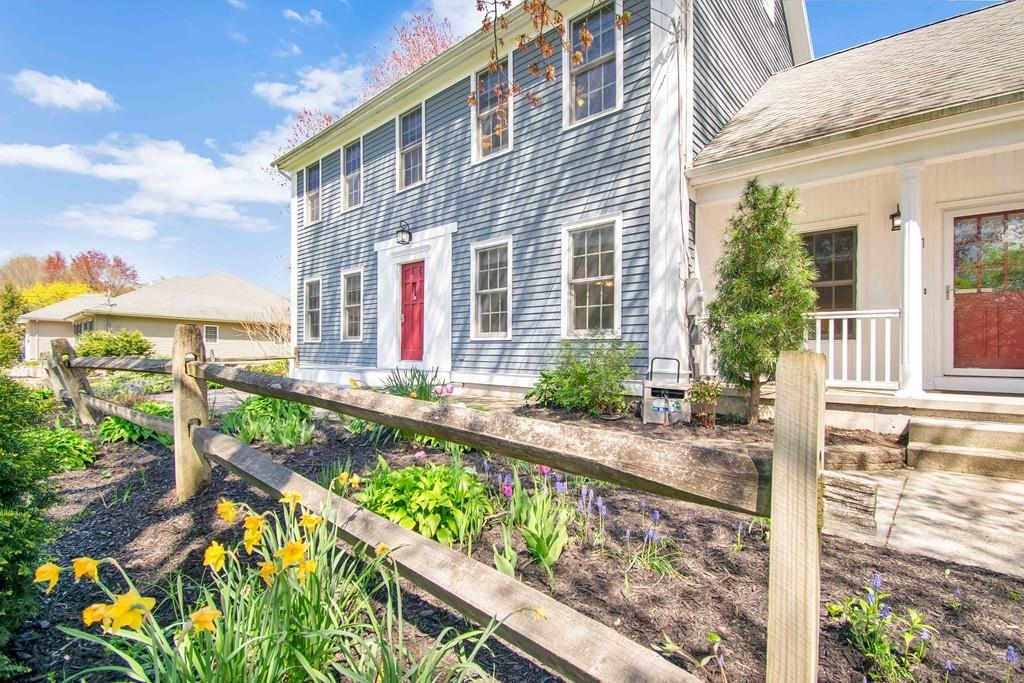 51 Steele Road Enfield, CT 06082 - Photo 2 of 42 a front view of house with a yard and potted plants