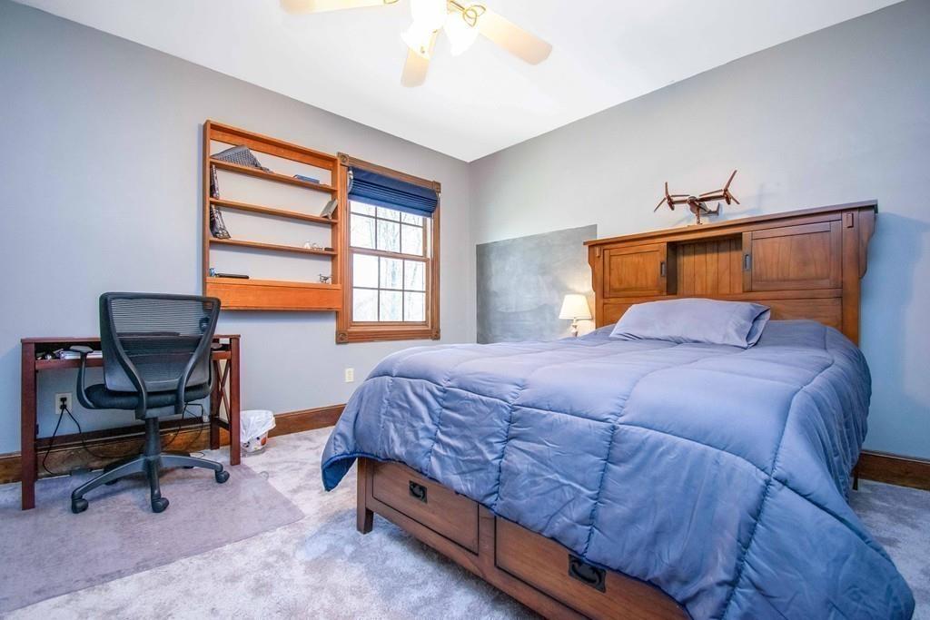 51 Steele Road Enfield, CT 06082 - Photo 27 of 42 a bedroom with a bed and a window