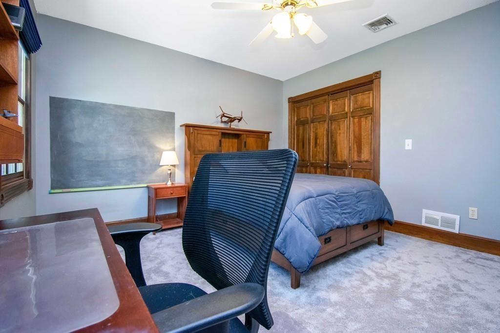 51 Steele Road Enfield, CT 06082 - Photo 28 of 42 a bedroom with a bed and window