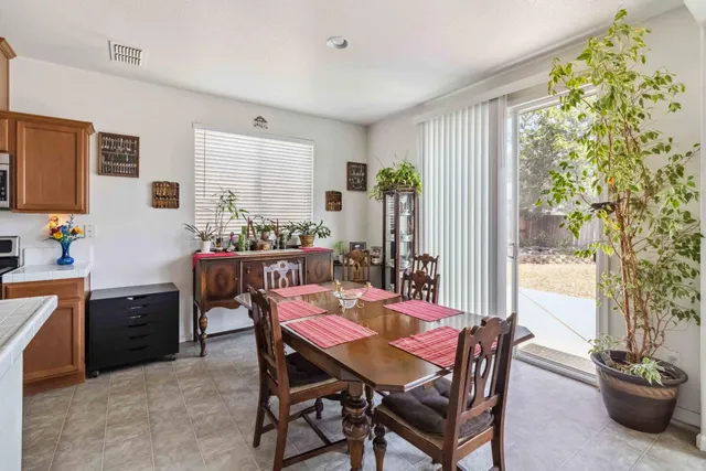 a view of a dining room with furniture and window