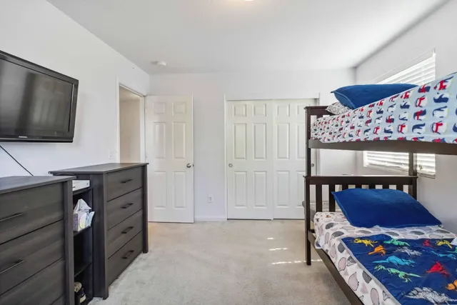 a view of a hallway with rooms