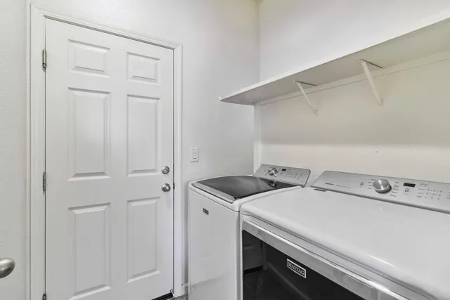 a backyard of a house with yard and outdoor seating