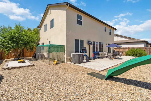 a view of a park with swings and slides