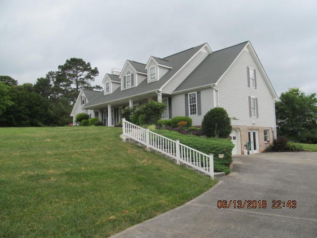 8200 Greenbriar Road Talbott, TN 37877 - Photo 15 of 18 a front view of house with yard and green space
