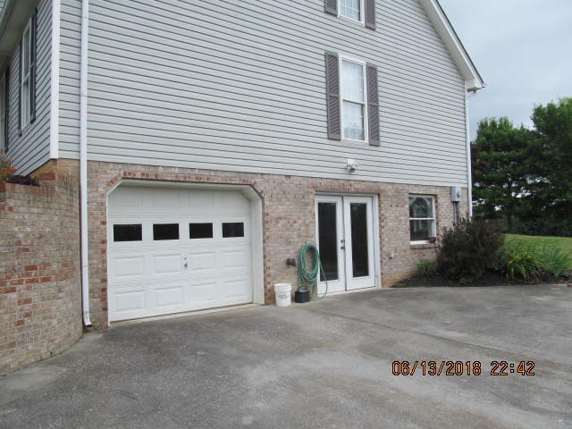 8200 Greenbriar Road Talbott, TN 37877 - Photo 17 of 18 a front view of a house with a yard