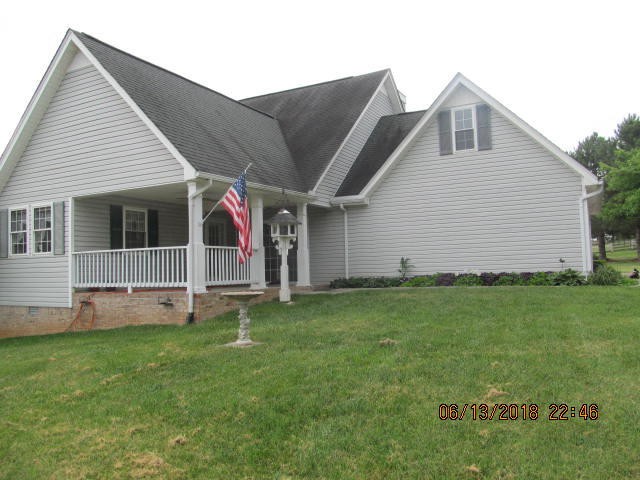 8200 Greenbriar Road Talbott, TN 37877 - Photo 18 of 18 a front view of house with yard and green space
