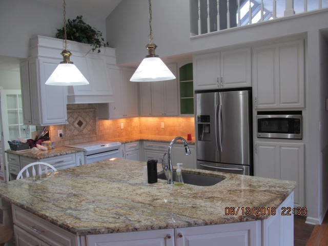 8200 Greenbriar Road Talbott, TN 37877 - Photo 4 of 18 a kitchen with stainless steel appliances granite countertop a sink refrigerator and microwave