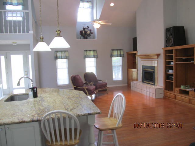 8200 Greenbriar Road Talbott, TN 37877 - Photo 5 of 18 a living room with furniture a fireplace and a chandelier