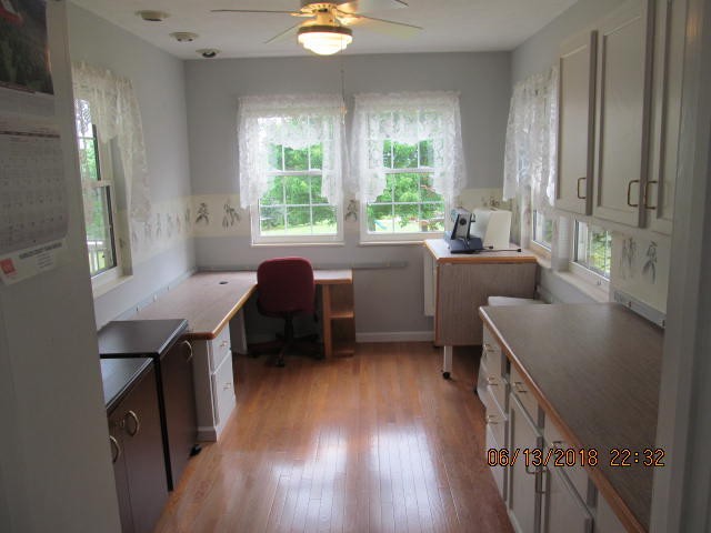 8200 Greenbriar Road Talbott, TN 37877 - Photo 6 of 18 a kitchen with a table chairs a sink dishwasher window and wooden floor