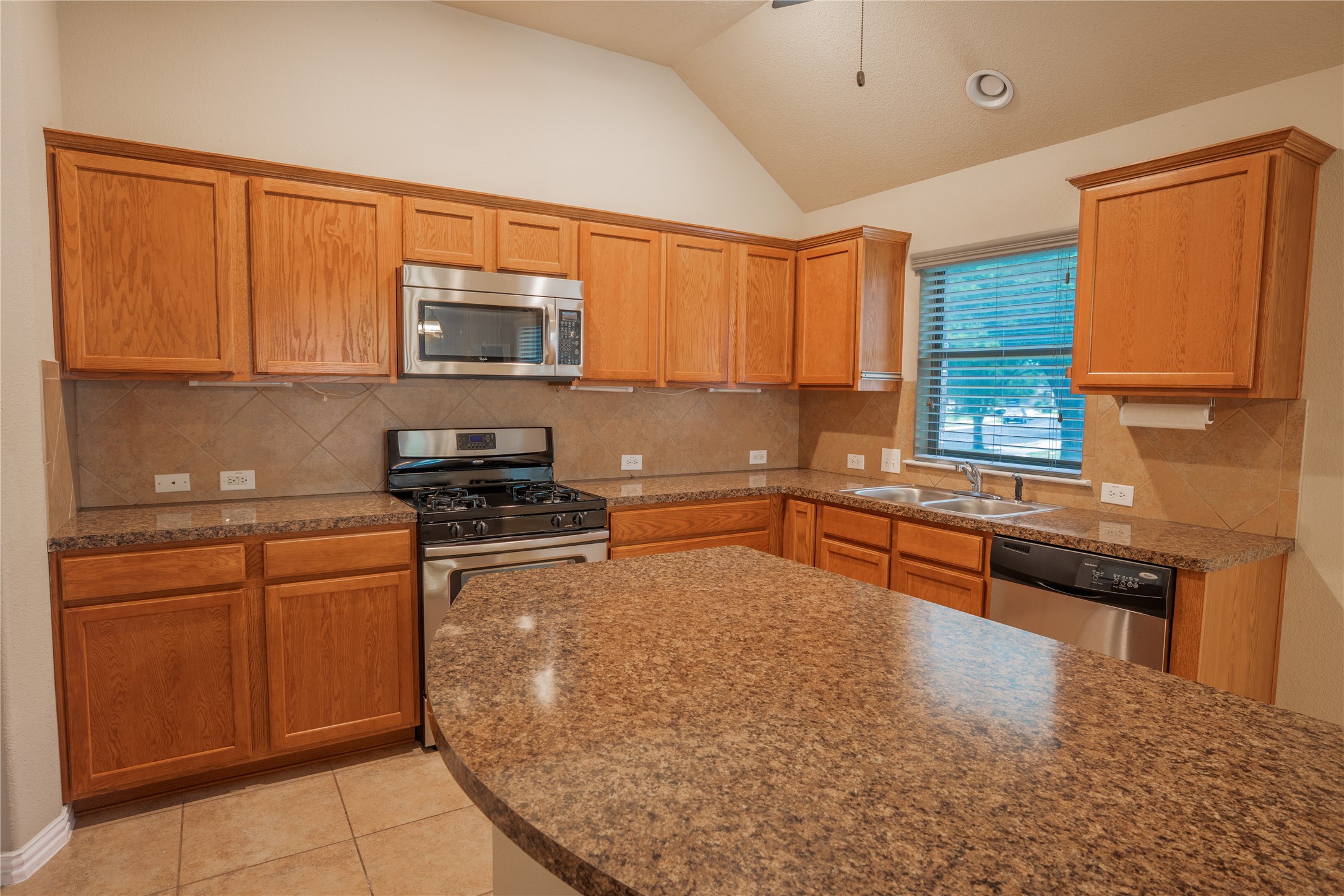 403 Tascate Street Georgetown, TX 78628 - Photo 5 of 26 A well-appointed culinary space featuring ample cabinetry and a convenient central island.